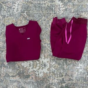 Figs scrubs
Small spot on top (photo attached)
1 pocket top 
Zamora jogger